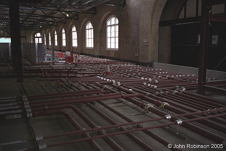 Pipework under main Drill Hall floor multiplying, mid-March